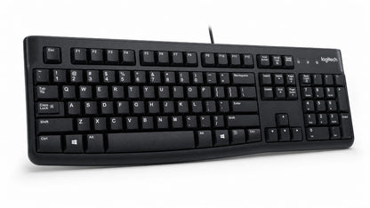 Logitech black wired computer keyboard with white lettering on the keys, shown at a three-quarter angle on a white background.