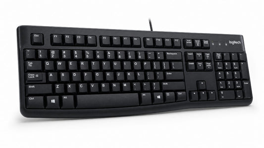 Logitech black wired computer keyboard with white lettering on the keys, shown at a three-quarter angle on a white background.